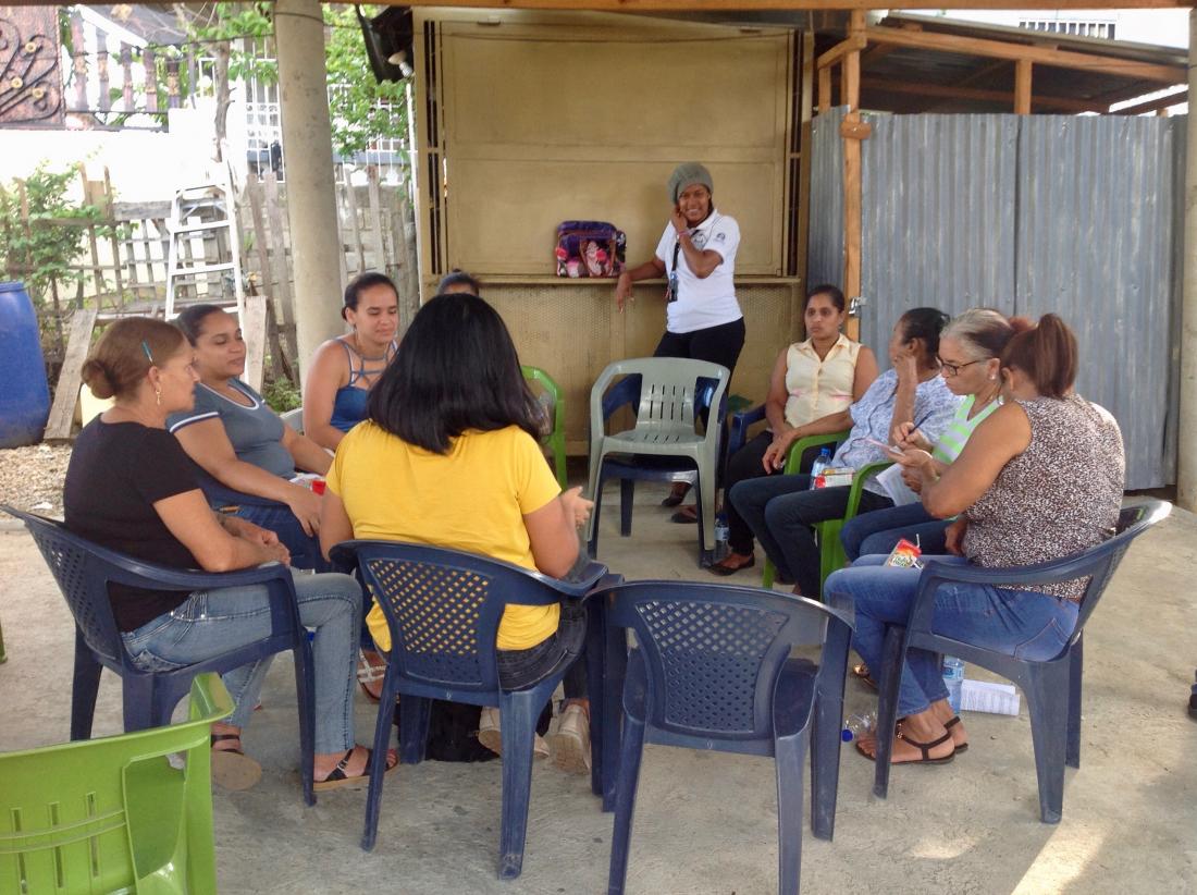women sit in circle group meeting dominican republic credit score digital