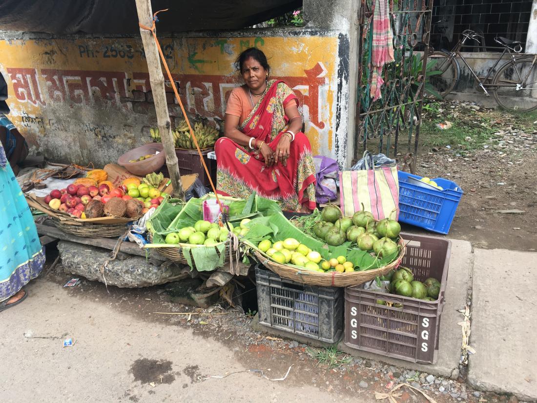 Woman selling produce in Kolkata.