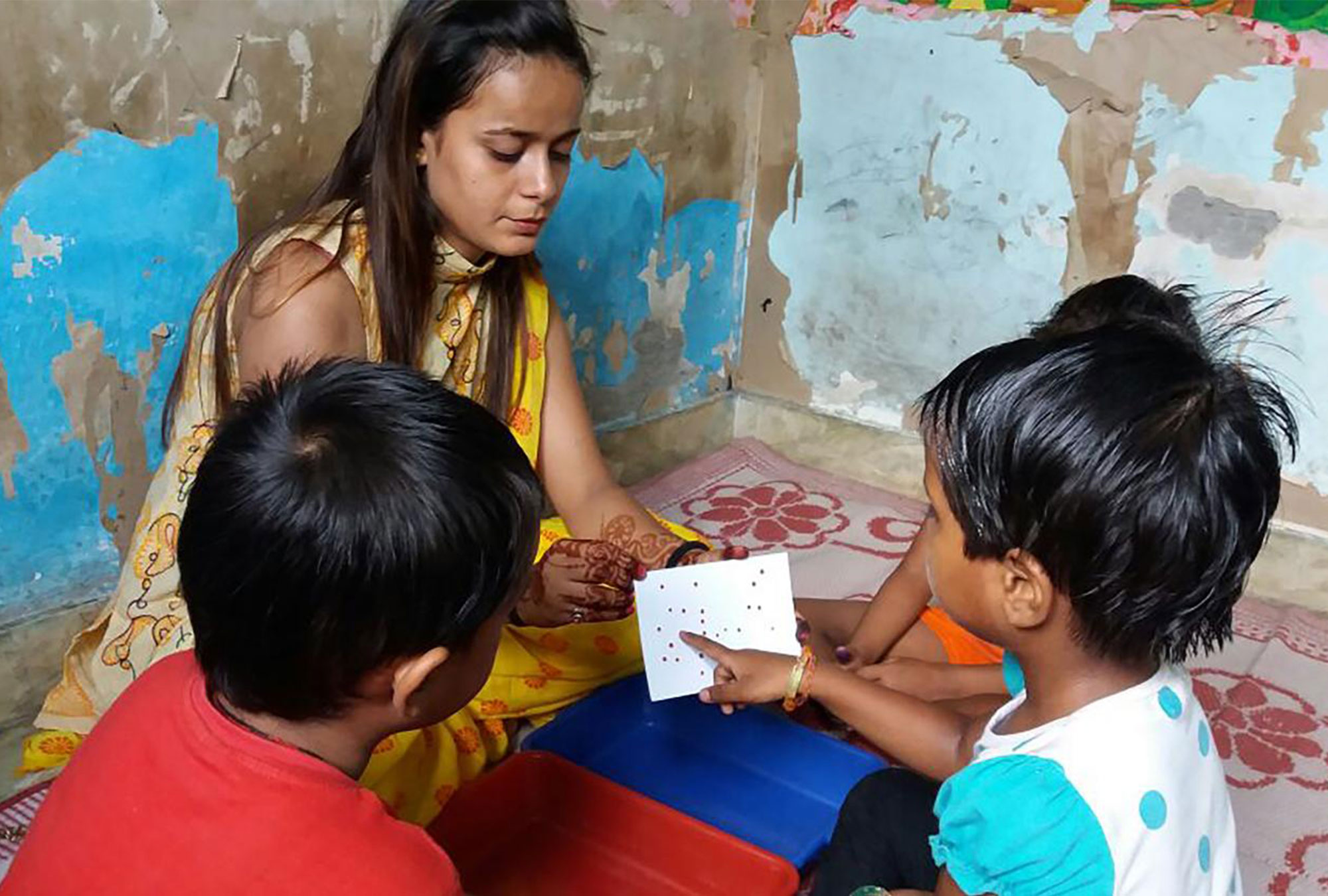 Woman shows games to children