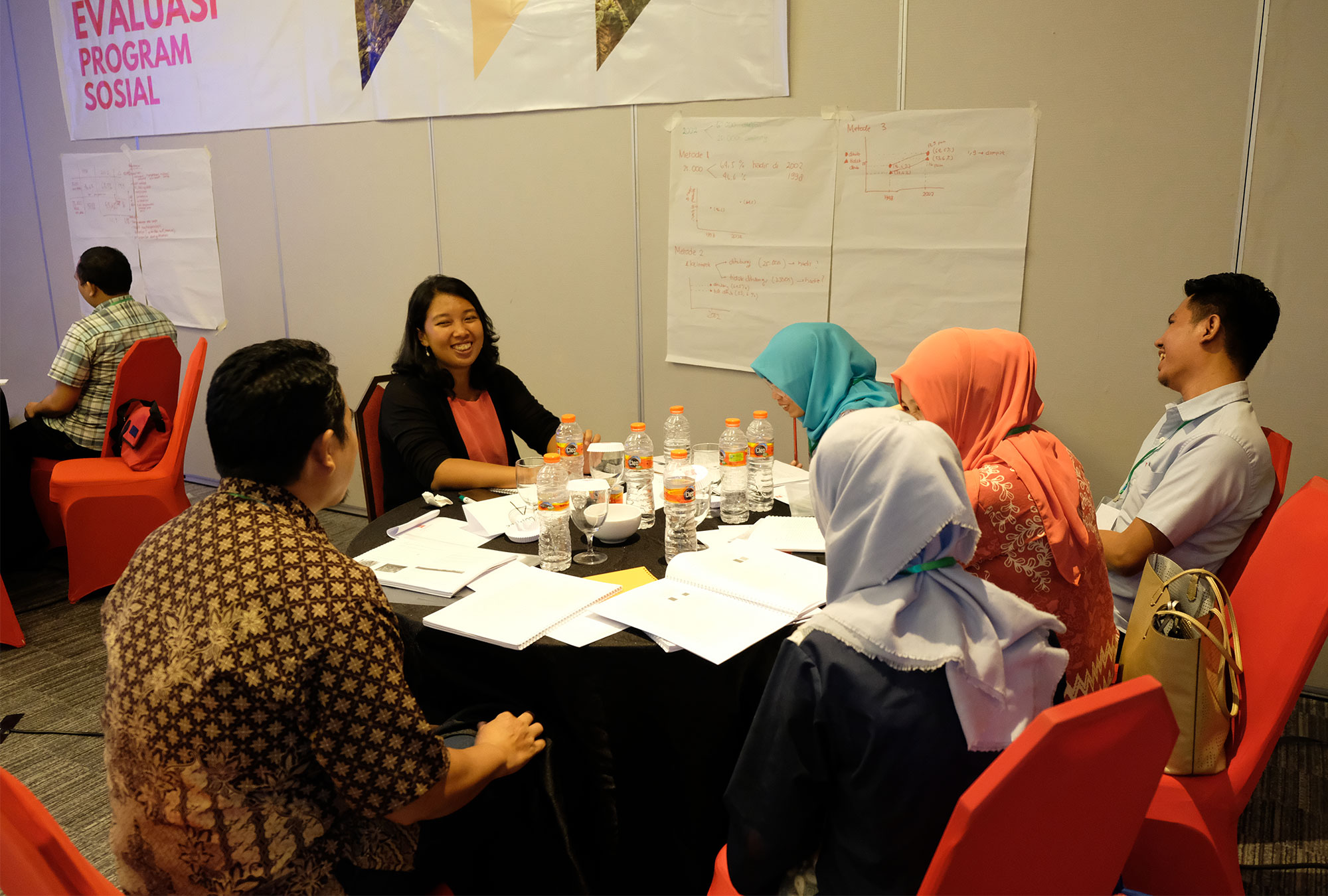 A discussion group seated at a round table