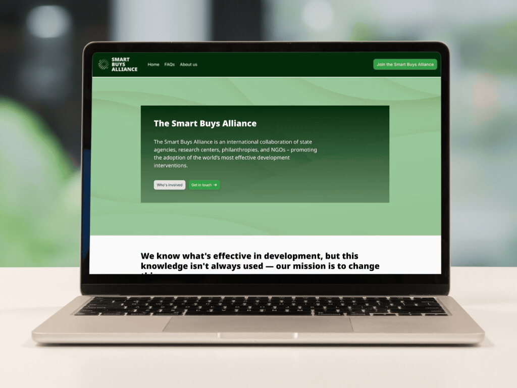 Laptop on desk scrolling Smart Buys Alliance website