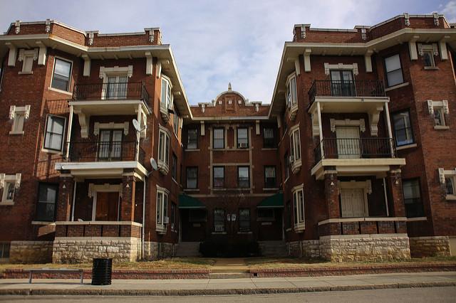 Brick apartments pictured from the street