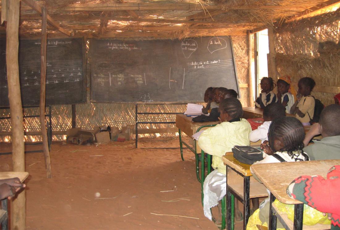 Children in classroom with blackboard