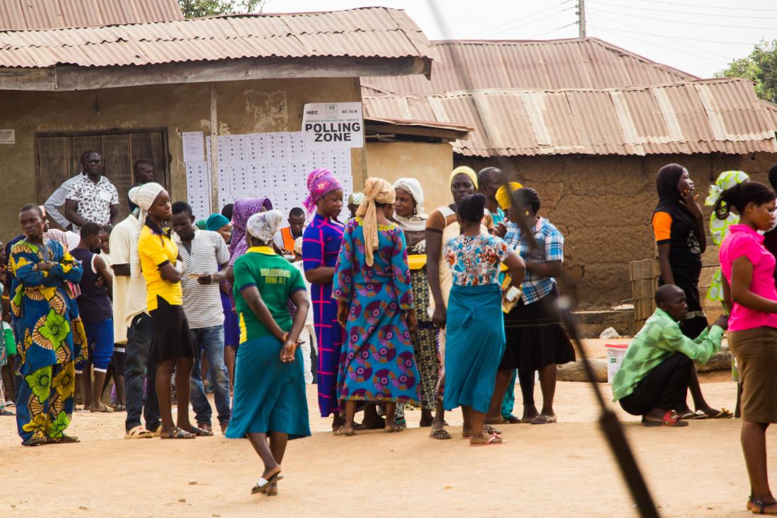 A group of people in Nigeria enters a polling station