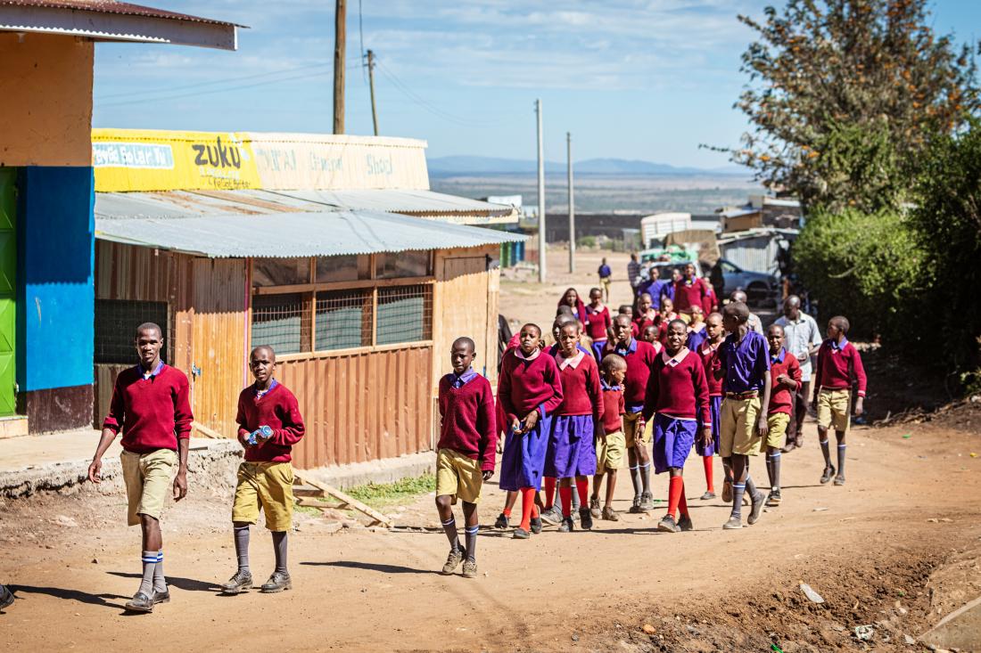 group of students walking together in groups