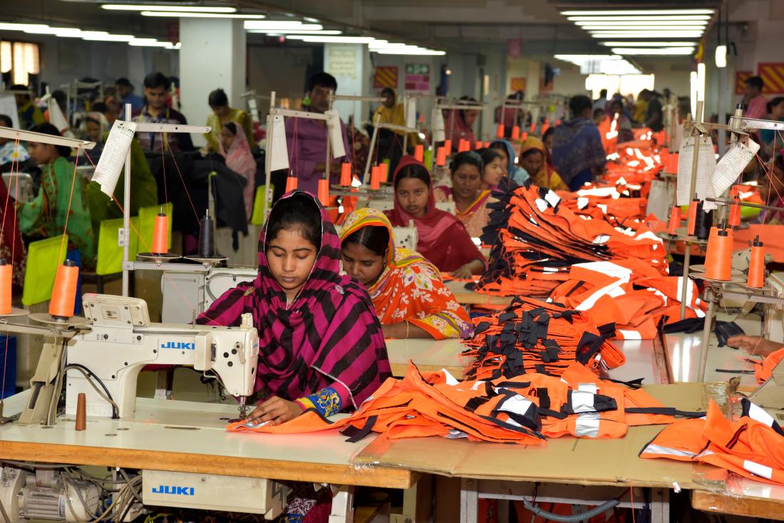 women using sewing machines in a garment factory in Bangladesh