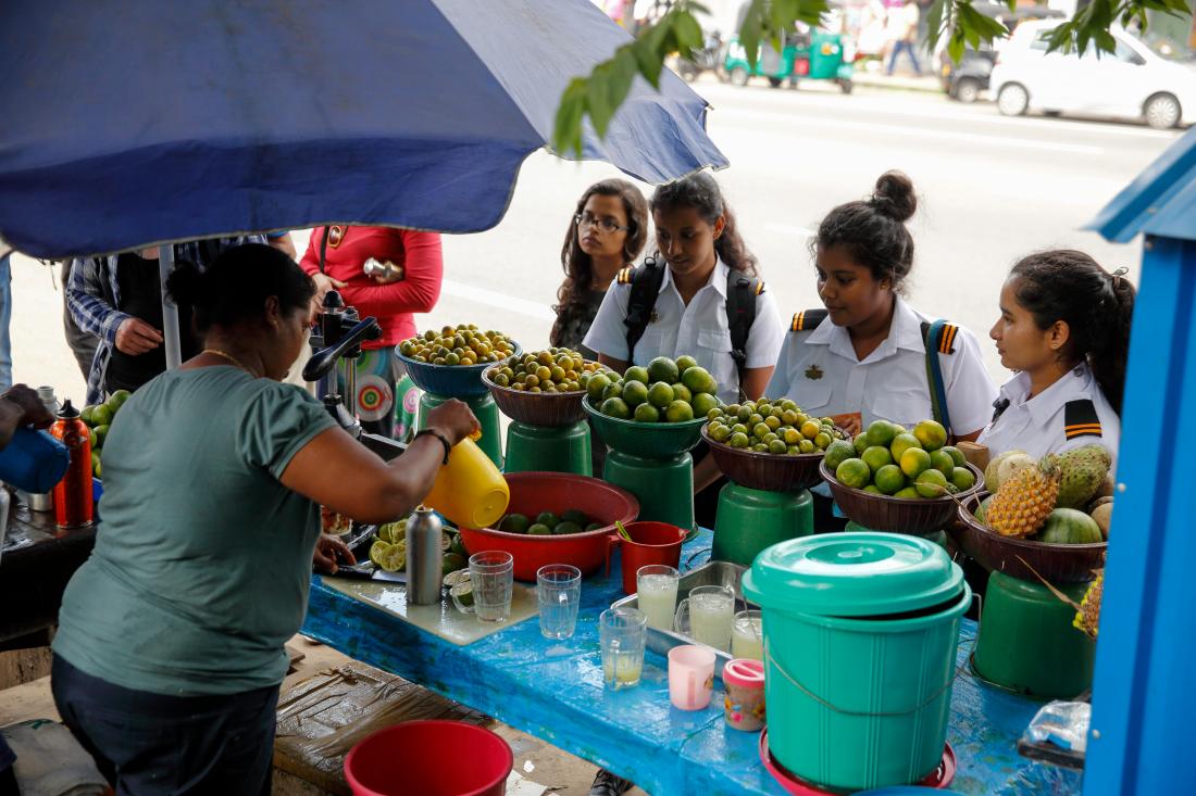 juice vendor and group of female students