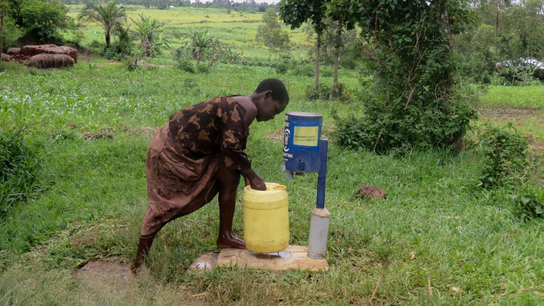 Boy using a chlorine dispenser