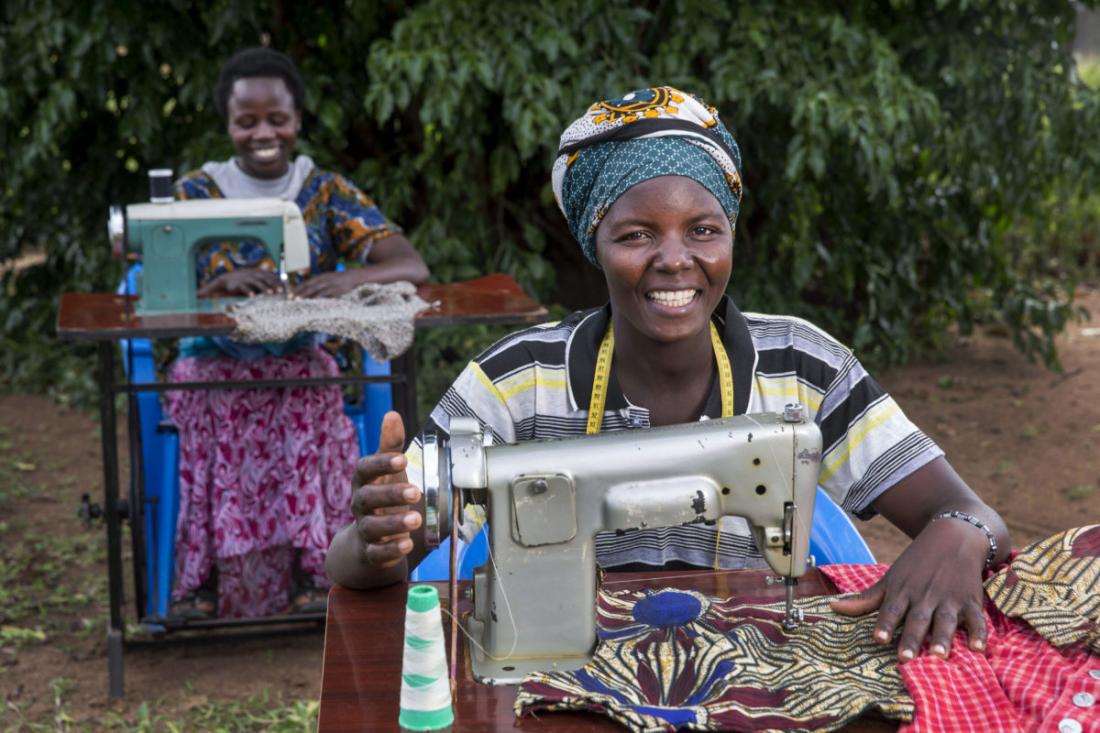 Women in Kataek, Uganda, make cloths to sell in small-scale trading.