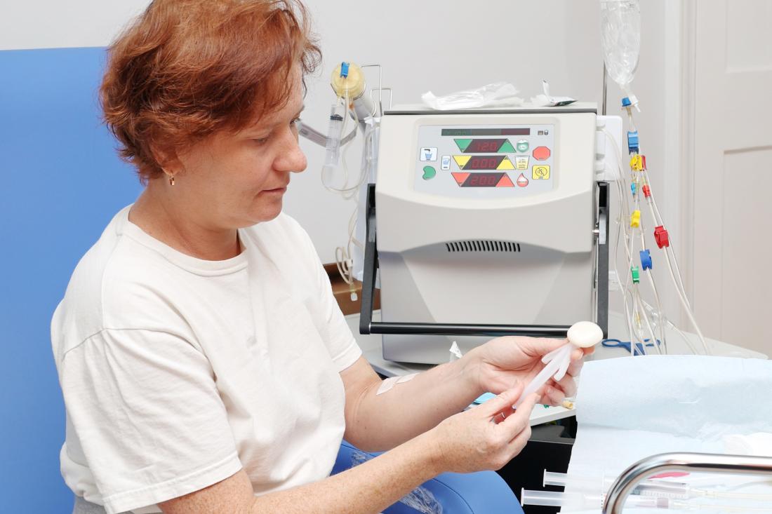 Woman sits in a medical setting