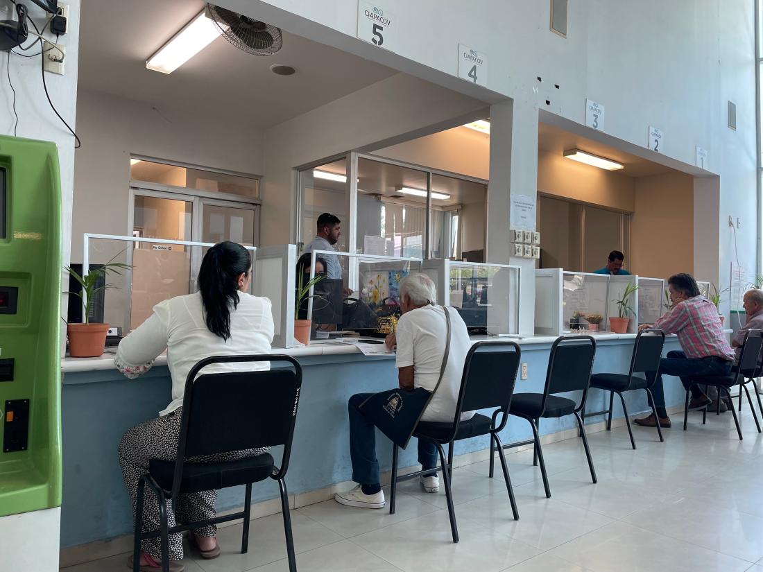 Group of people in waiting room, in Mexico.