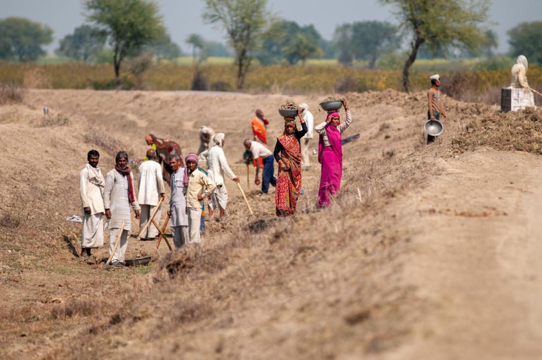 Local Villagers digging and cleaning canal under National Rural Employment Guarantee Act, government providing job for rural living people