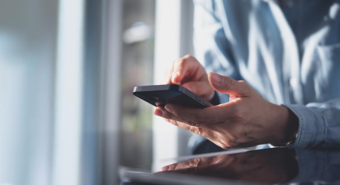 Close up, business woman using mobile smart phone