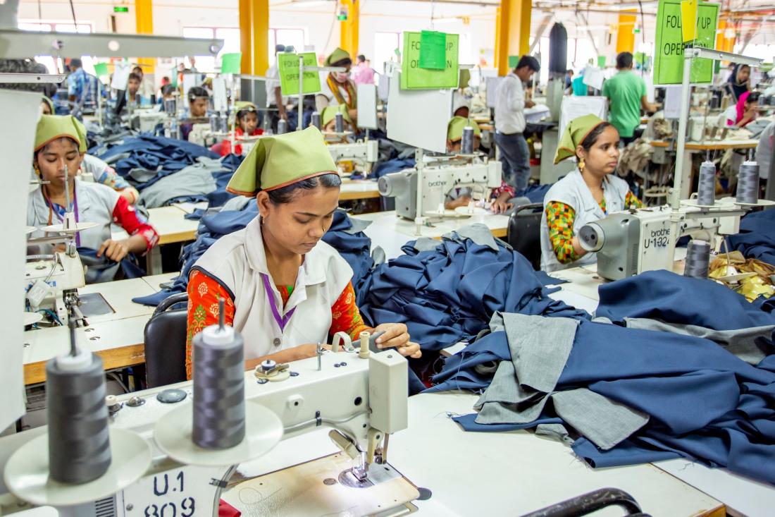 Workers and supervisors on garment factory shop floor in Bangladesh