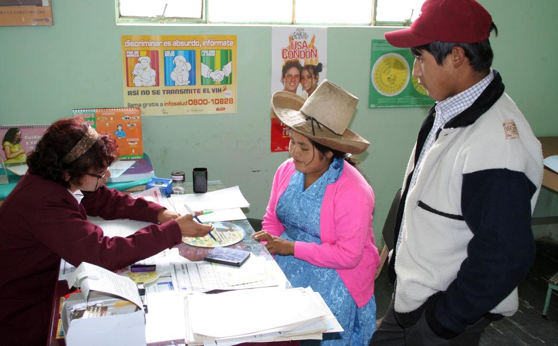 Peruvian woman receives educational information on healthcare services from trained counselor in Peru