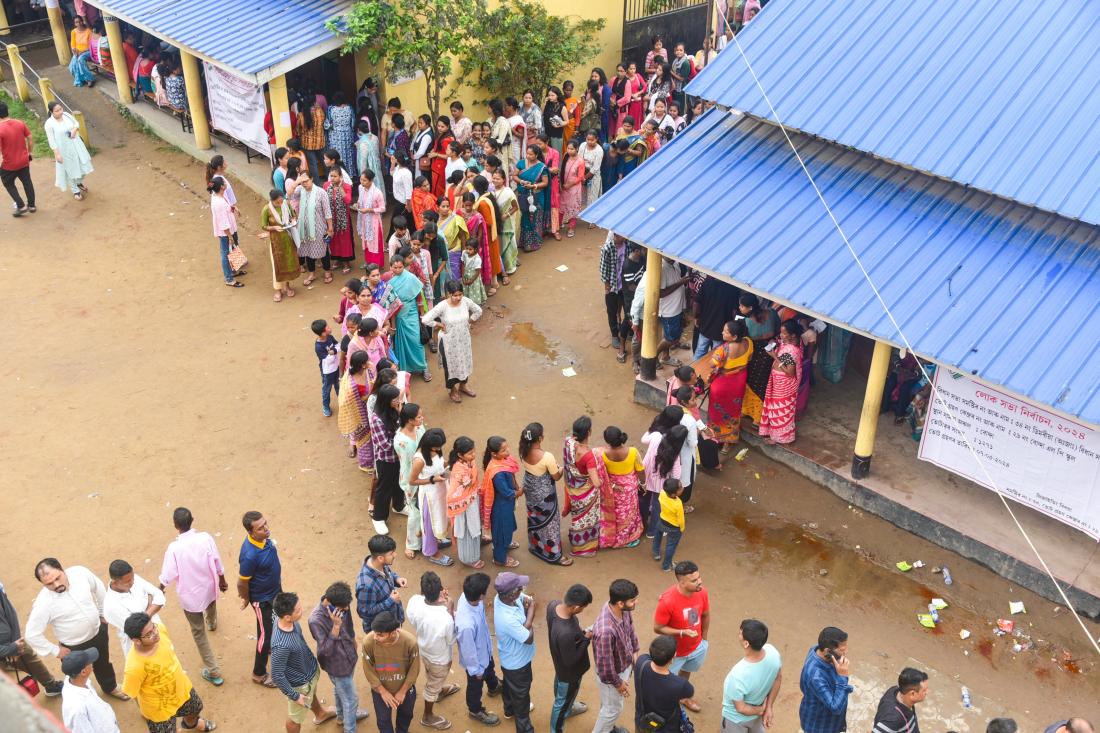 Voters in Delhi waiting in line at election poll