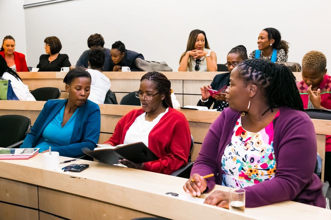 Women attending a presentation in South Africa J-PAL Africa evaluation summary