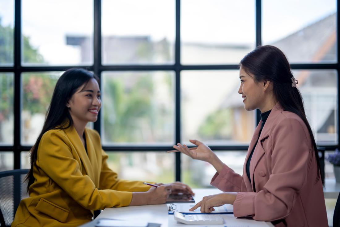 Women discussing finance in Philippines