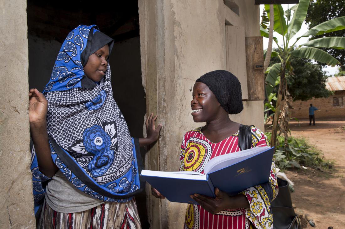 Women talking to each other in Uganda J-PAL Africa evaluation summary