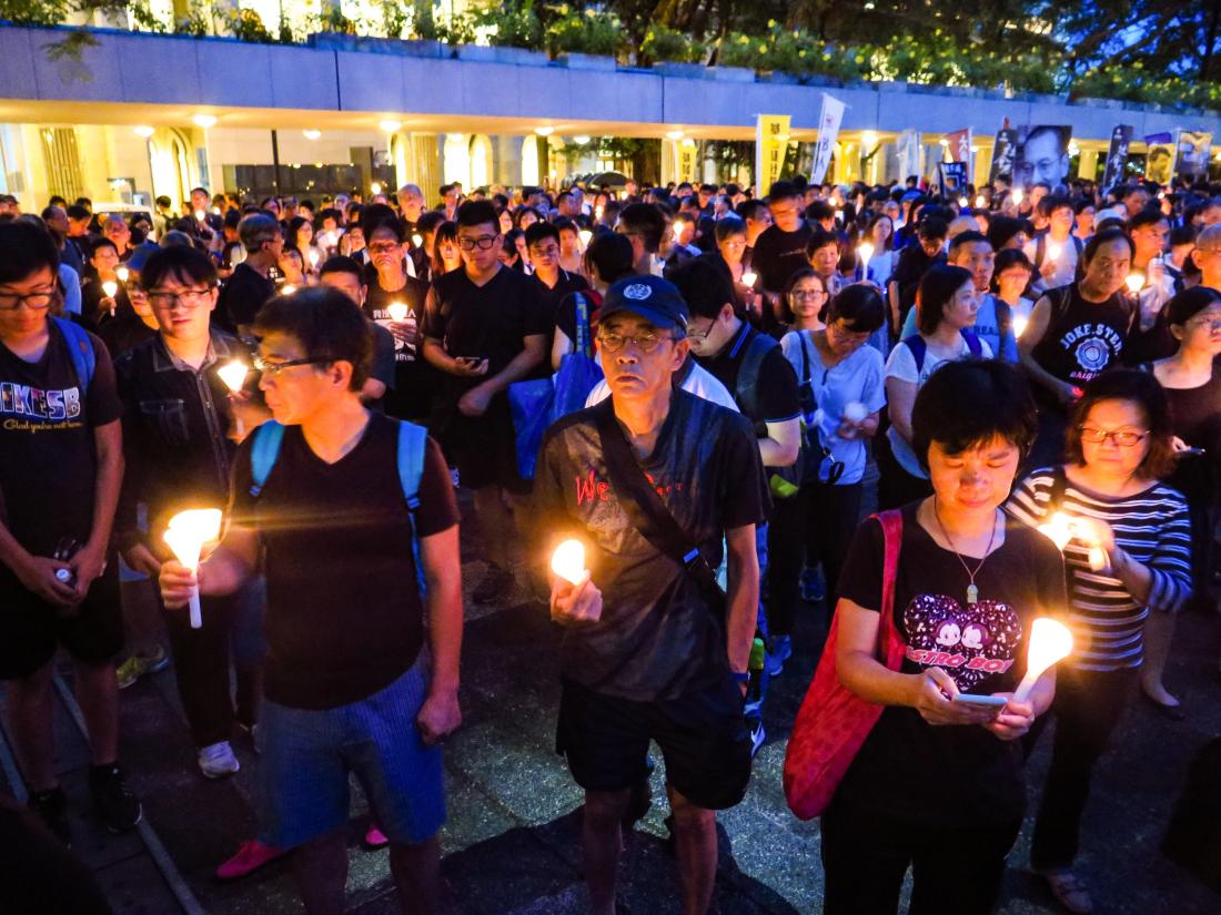 Protest movement with crowd holding candles in China
