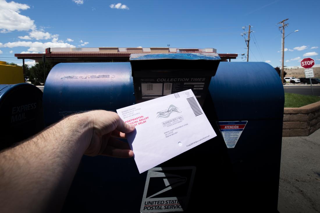 A person casts vote by mail and increasing voter turnout in the United States