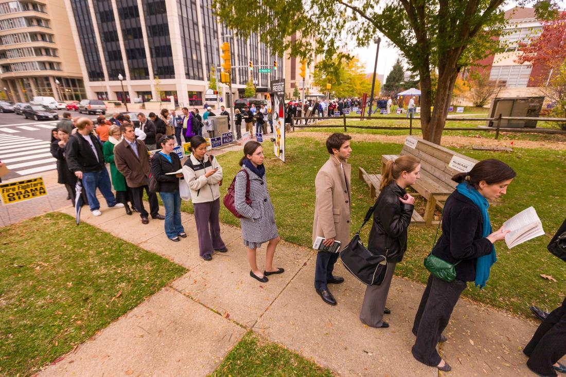 Angled view of voter turnout line outdoors in the United States