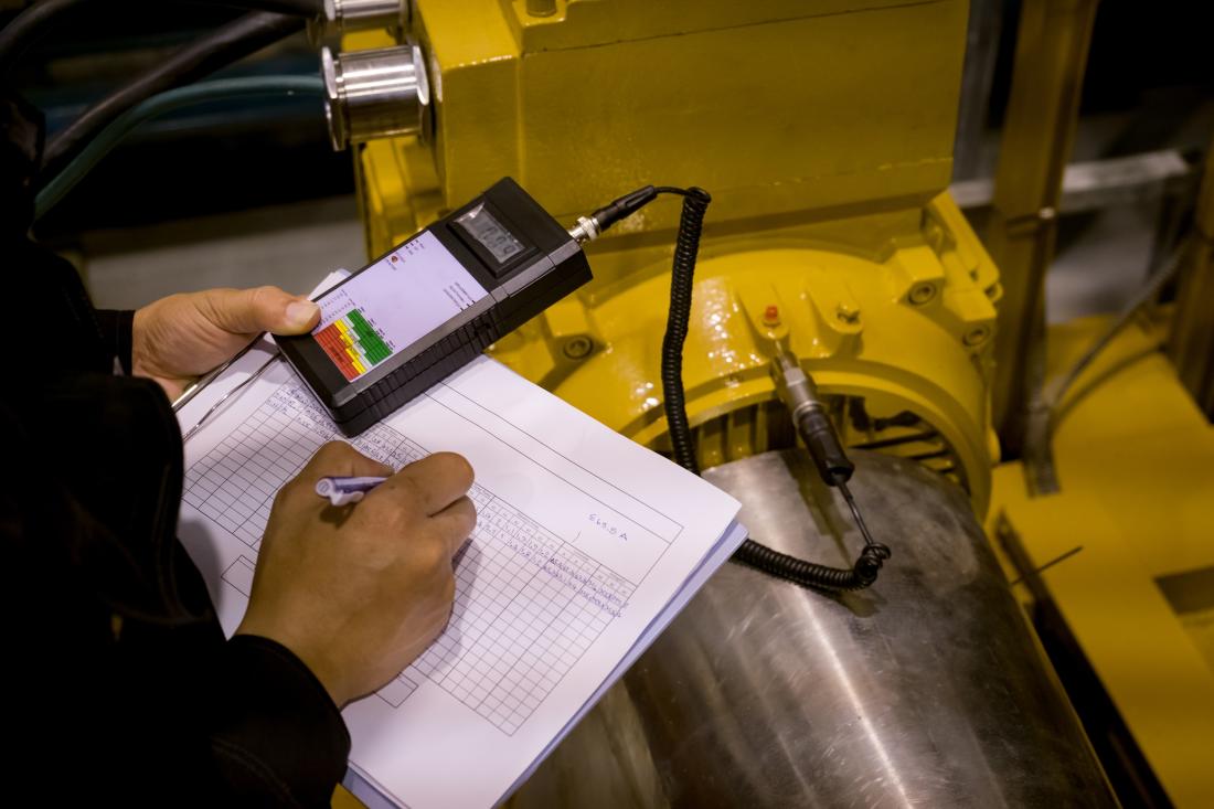 Technician inspecting a power plant, India J-PAL South Asia evaluation summary 