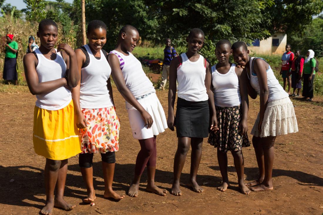 Young girls that are participants of group-based therapy stand in group for photo in rural Uganda.