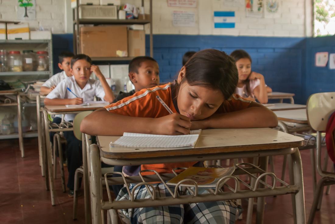 Female secondary school student focuses on education in El Salvador.