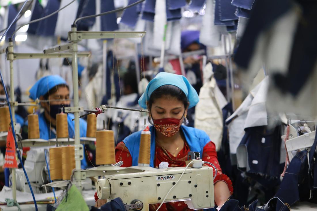 Women work at a ready-made garment factory