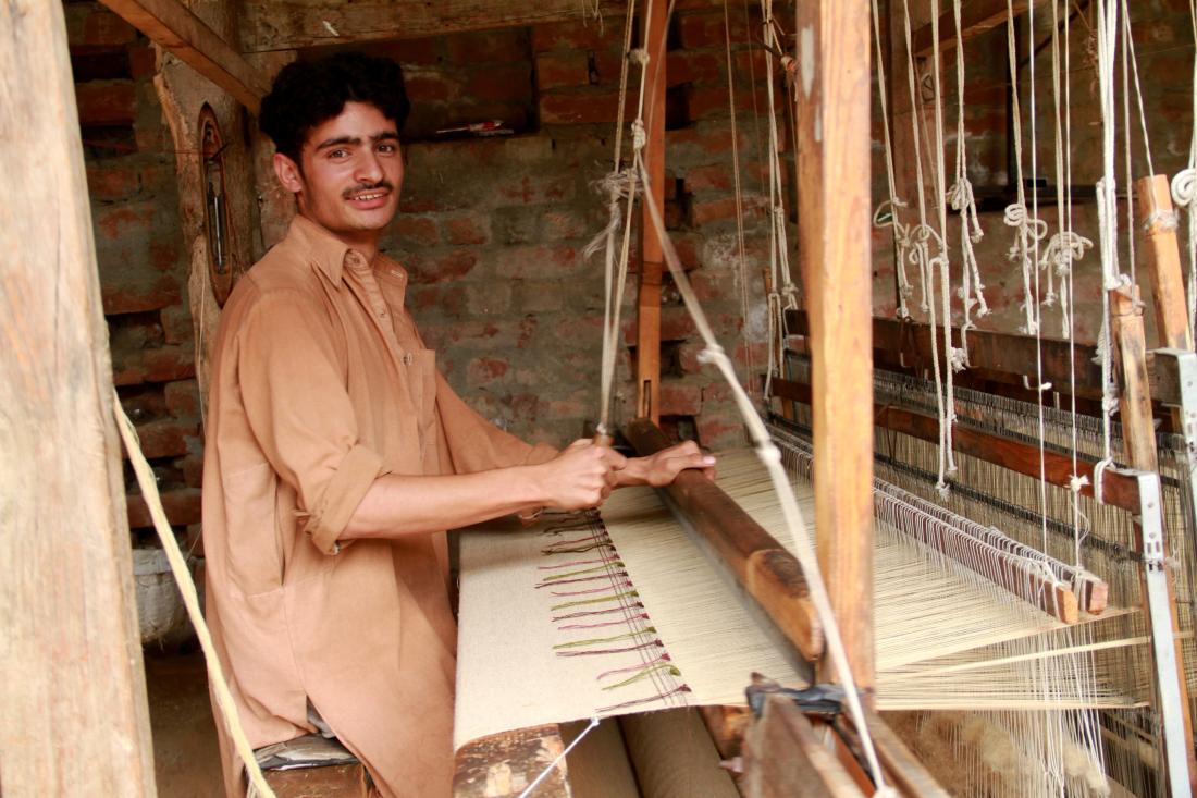 Man making a carpet