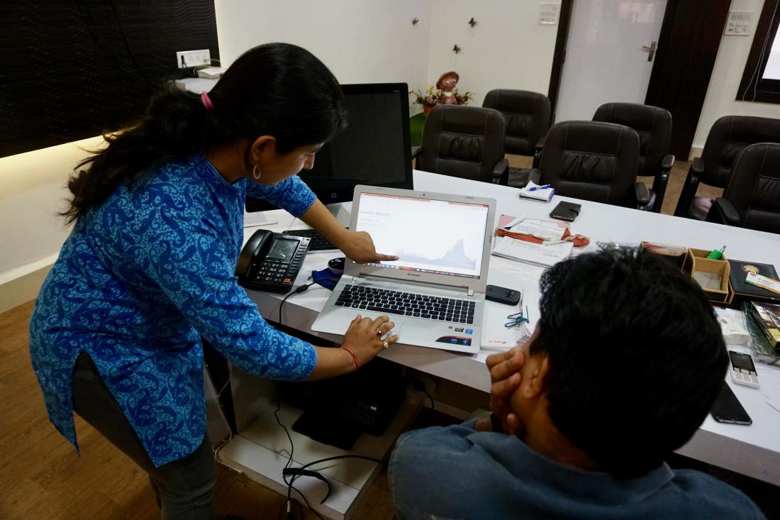 Bureaucrats using PayDash platform on a laptop