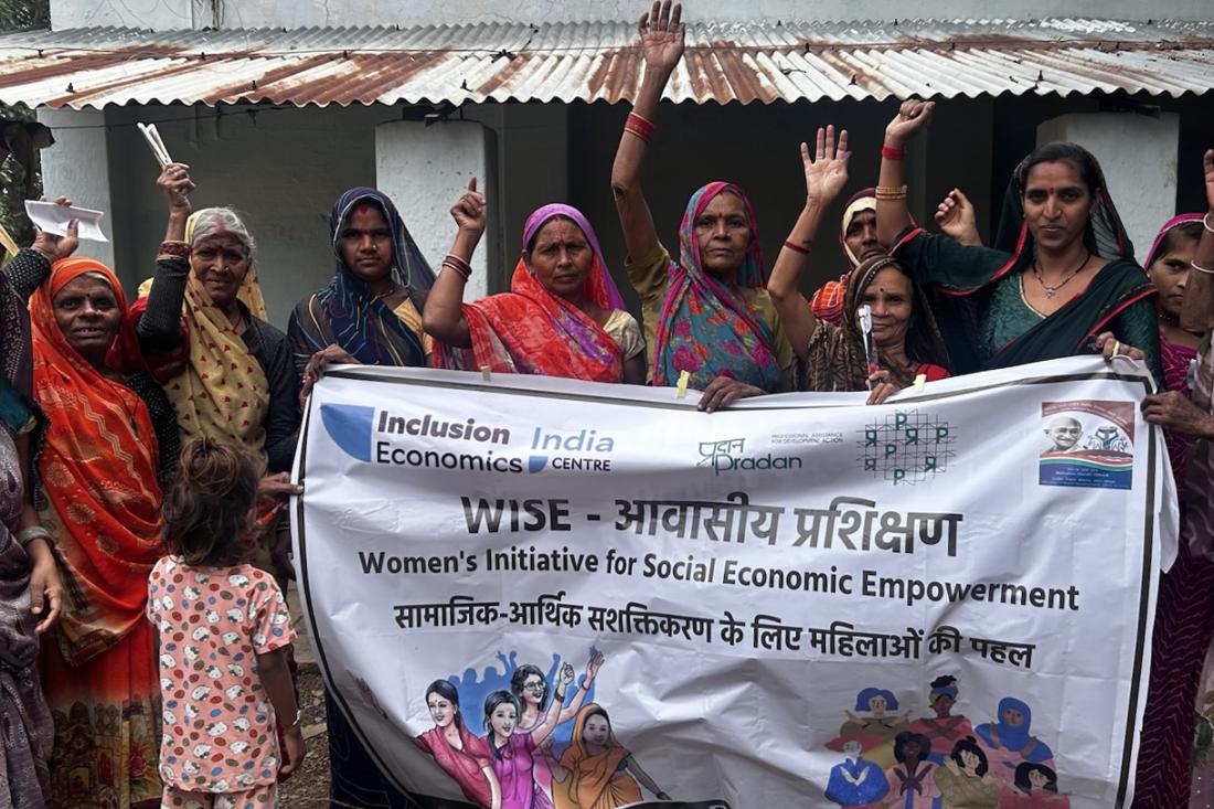 A group of women holding an initiative sign