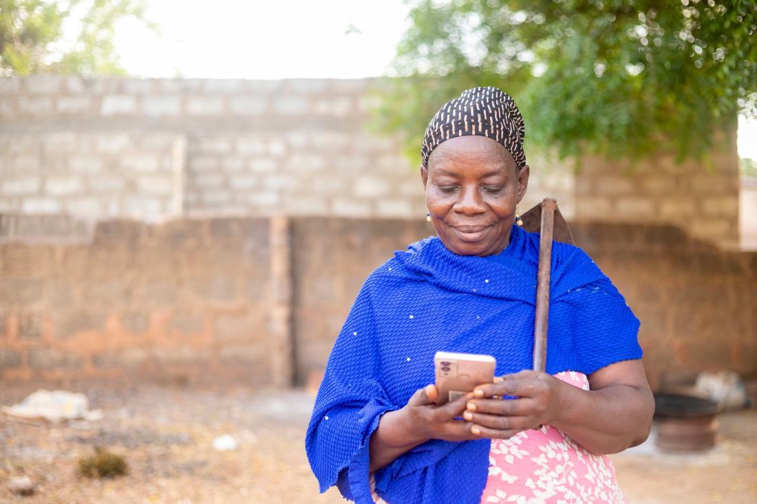 Woman with blue scarf and mobile phone