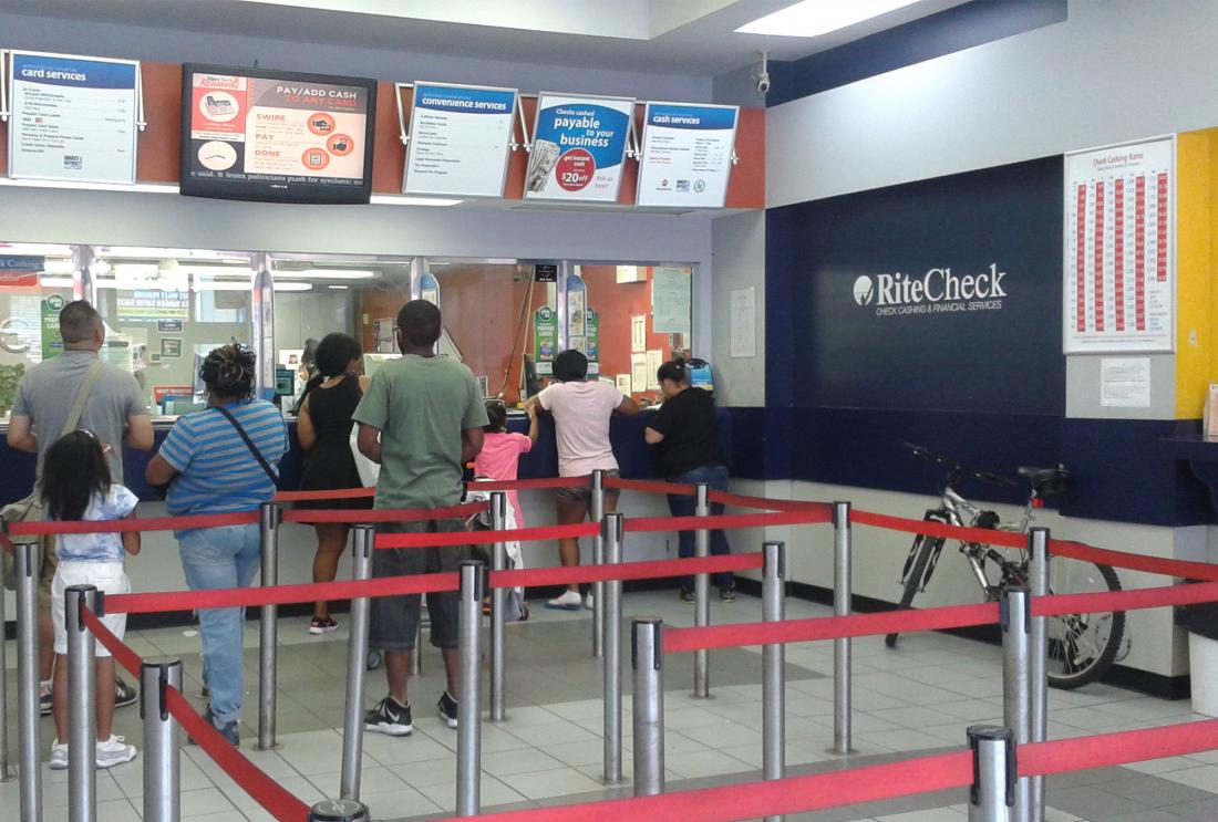 People stand in line at check cashing facility