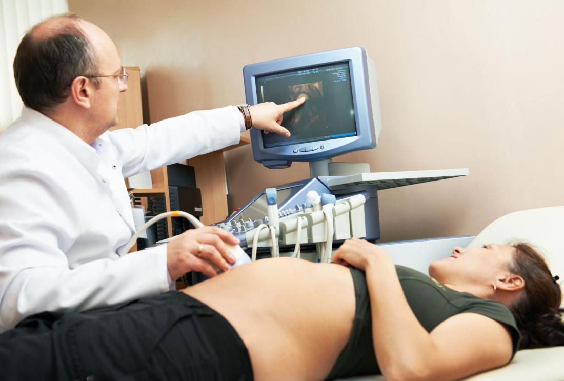 A pregnant woman receives prenatal care.