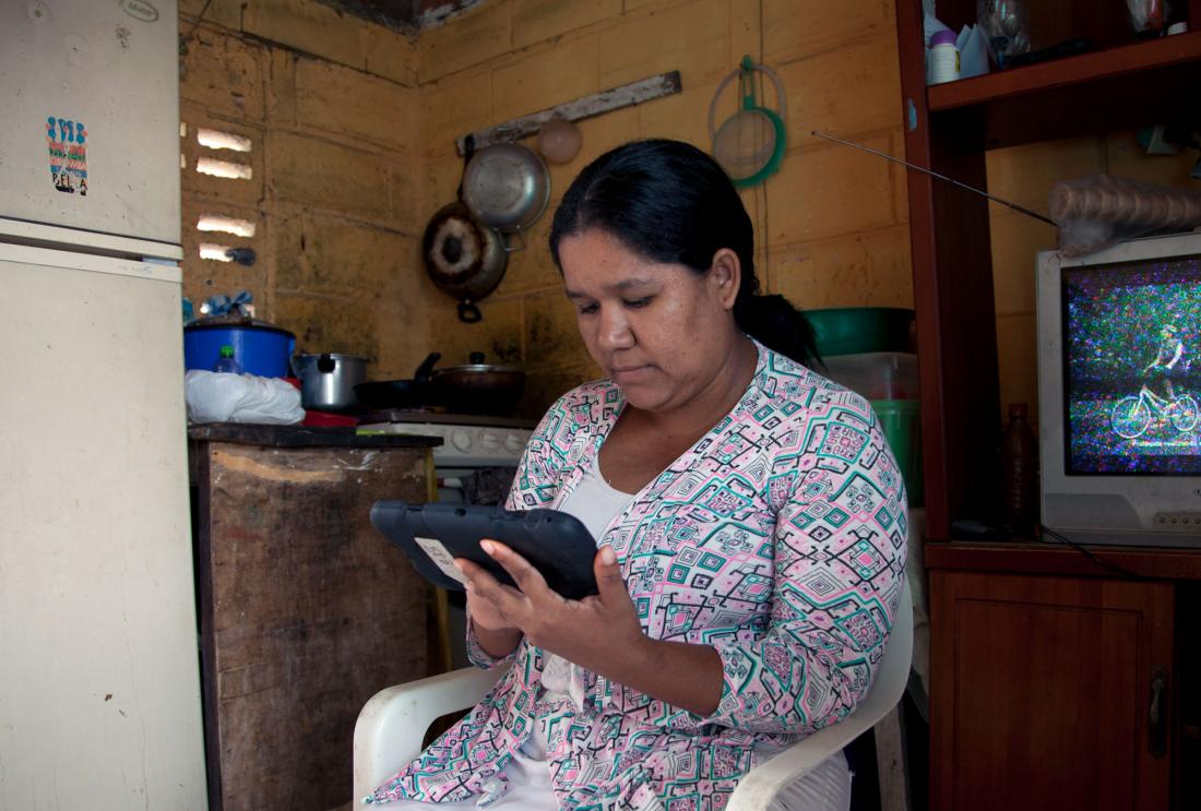 Woman using a tablet.