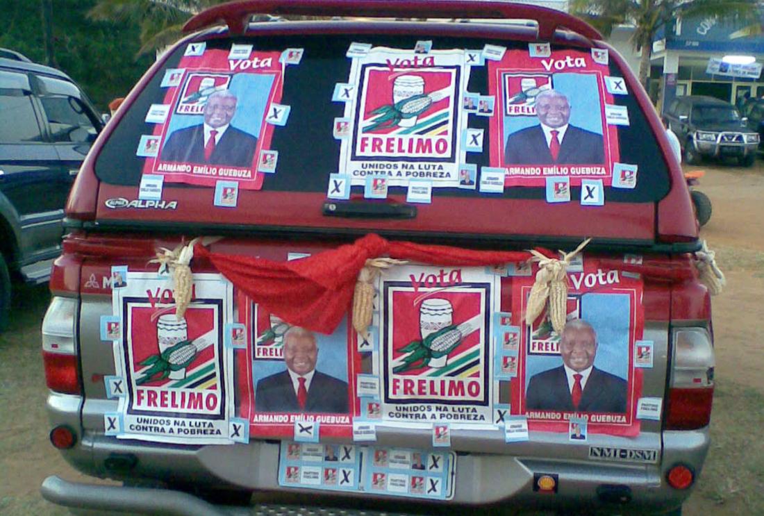 Red car with campaign posters supporting FRELIMO party