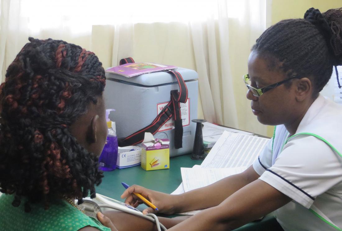 Woman in uniform shows patient papework