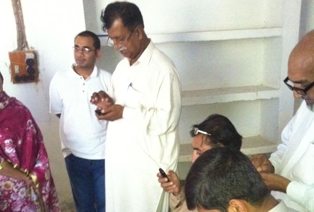 Group of people using phone in Pakistan