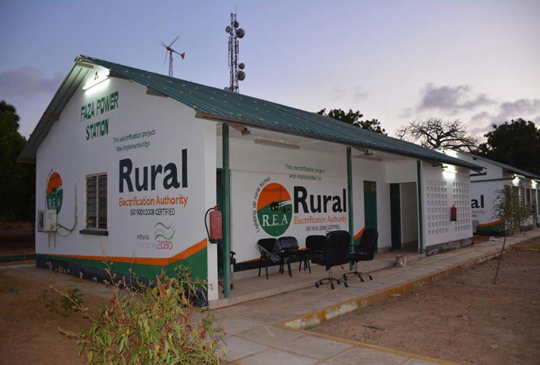 White building with Rural Electrification Authority logo painted