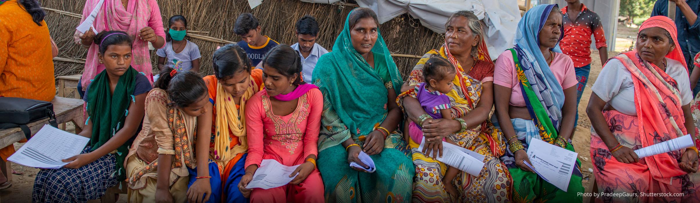 Women sitting together for a health camp