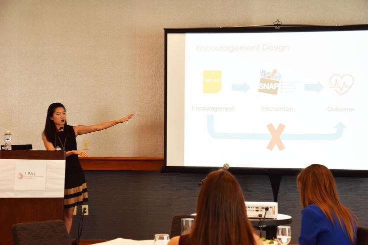 Woman presents slide on encouragement design