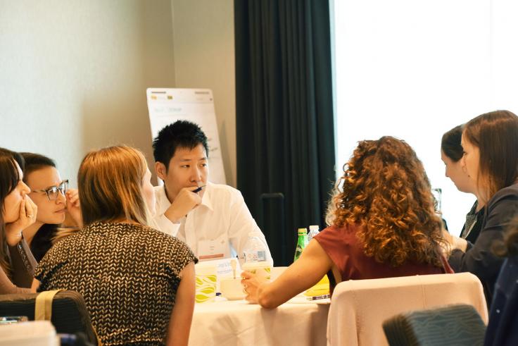 People in discussion at a table