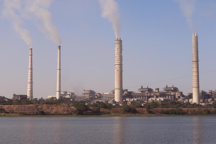 Factory buildings letting off pollution