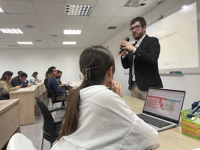 A man giving a presentation to a classroom.