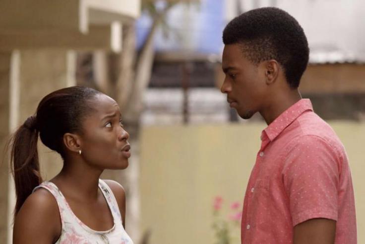 Young female adult speaking with a male young adult