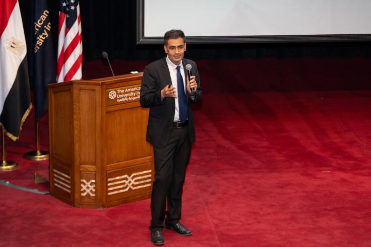 Iqbal Dhaliwal speaking on stage the the MENA anniversary event 