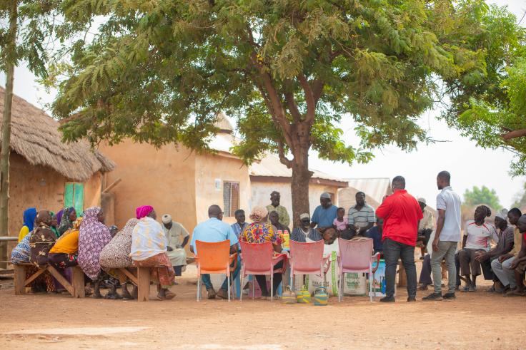 Farmers and villagers gather to discuss farming related concerns in West Africa