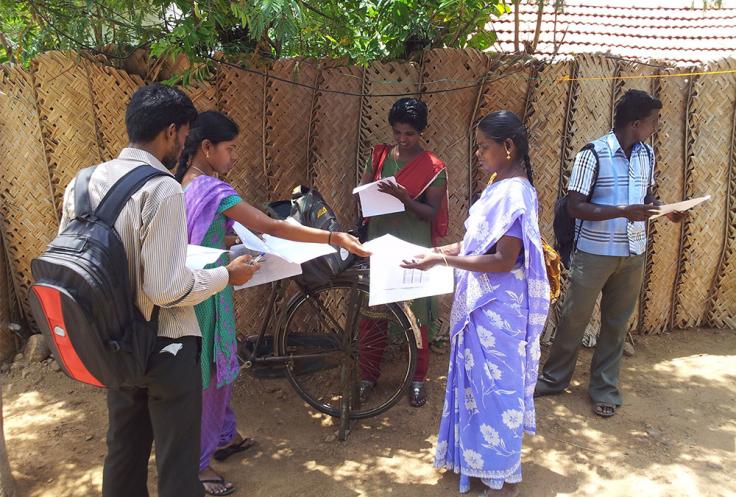 Surveyors examine paper forms